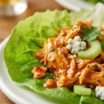 Buffalo Chicken Lettuce Wraps garnished with fresh vegetables