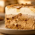 No-bake Biscoff Cookie Butter Icebox Cake topped with cookie crumbles