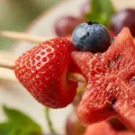 Colorful fruit kabob with watermelon stars for a summer party.