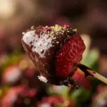 Chocolate dipped fruit skewers with vibrant strawberries and pineapple