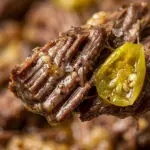 Delicious Slow Cooker Mississippi Pot Roast served with sides on a plate.
